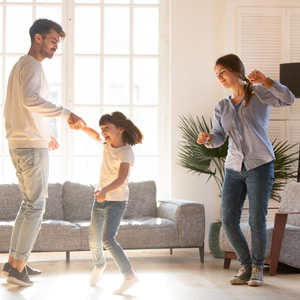 family dancing in the living room
