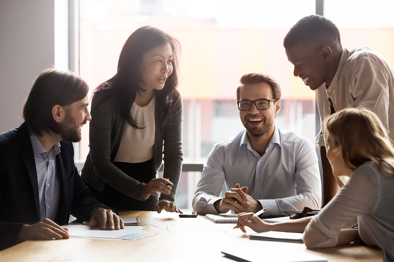Coworkers laughing in a meeting