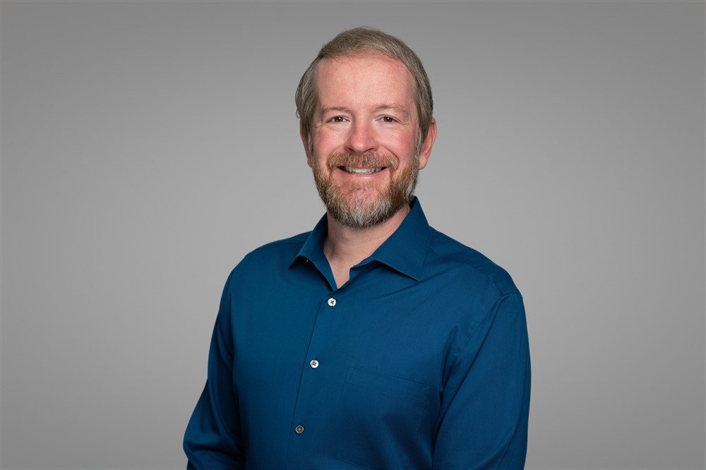 Headshot of Aaron Blom.