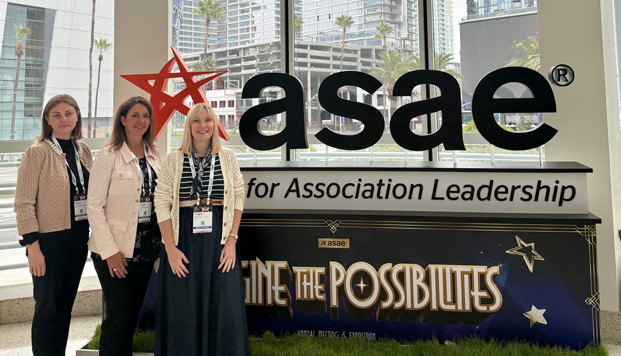 FGIA staff in front of ASAE sign at the conference