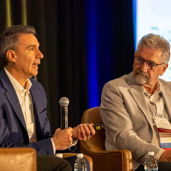 FGIA members in a meeting at a conference